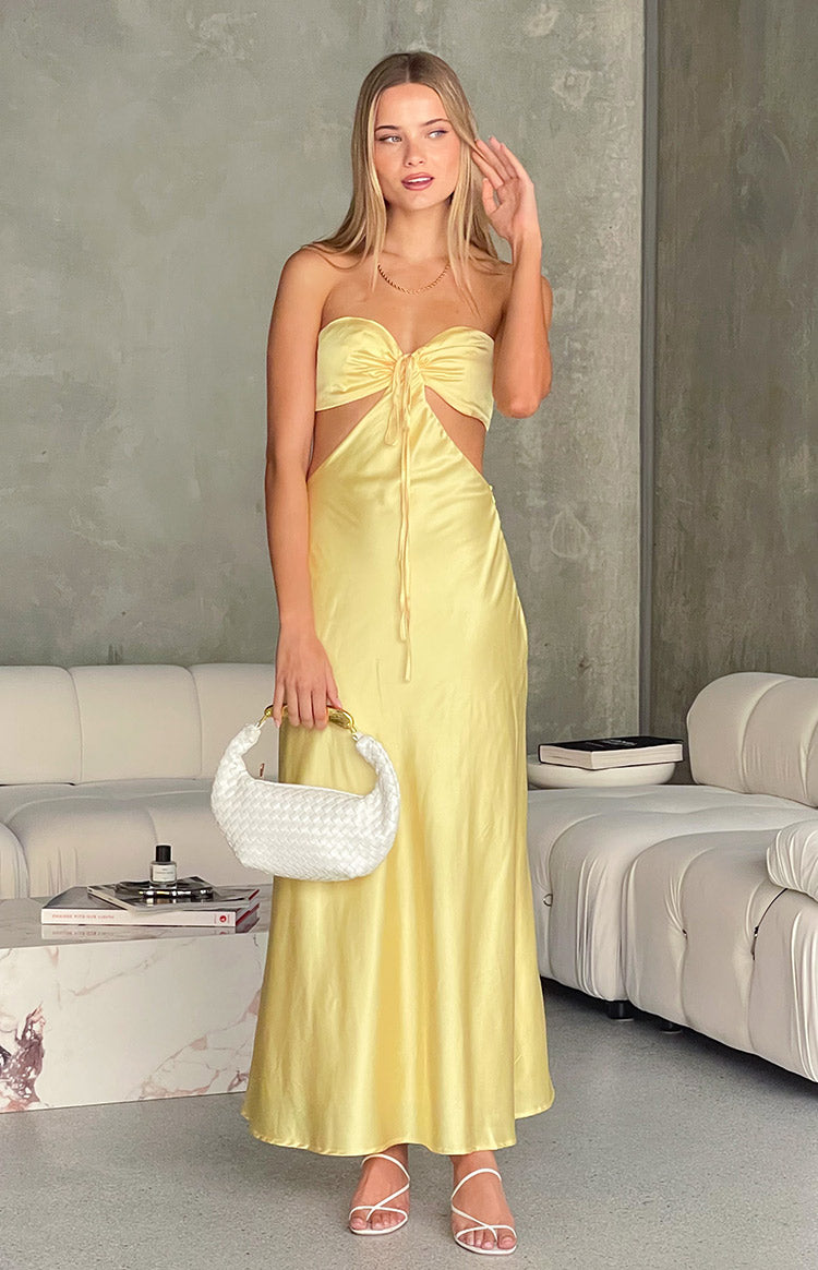 Beginning Boutique Lili Yellow Satin Strapless Maxi Dress yellow satin strapless maxi with tie-front bust and waist cutouts