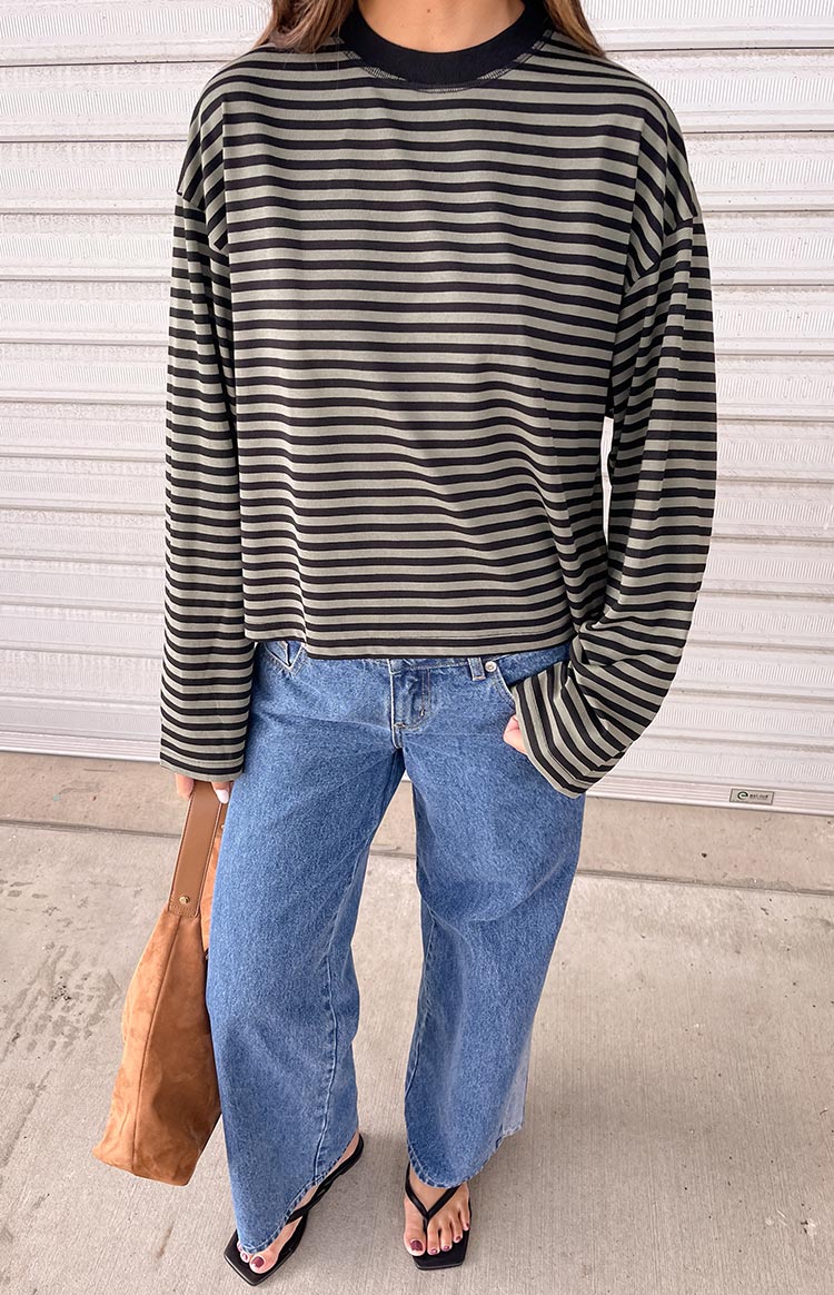 Black and forest green striped long sleeve top with a relaxed fit and slightly cropped hem