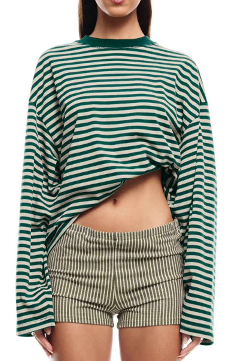 Close-up of the oversized green and off-white striped long sleeve top with a relaxed hem