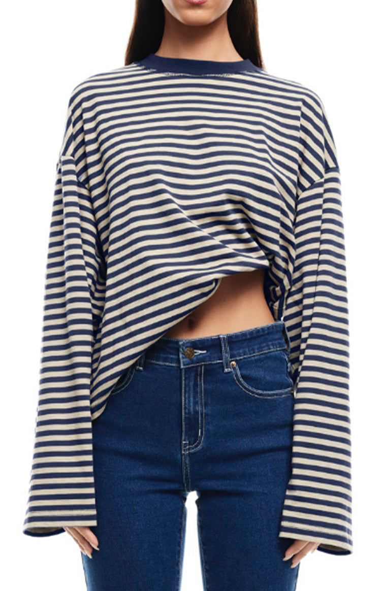 Front view of the navy and cream striped long sleeve top with wide, oversized sleeves and a cropped fit