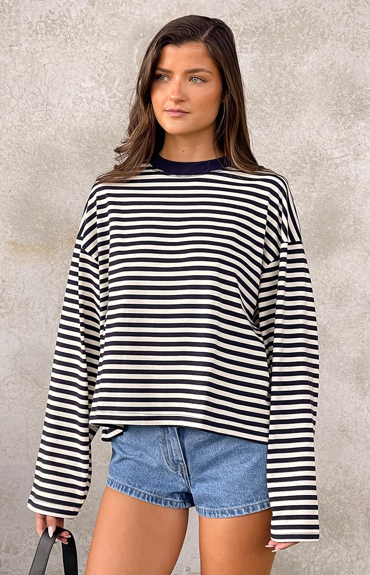 Front view of a navy and white striped long sleeve top with a relaxed fit and crew neck