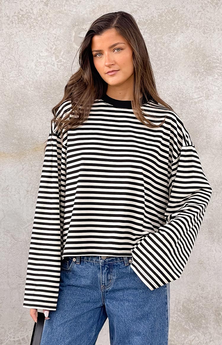 Beginning Boutique Lioness Bloom Onyx Stripe Long Sleeve Top black and white striped crew neck long sleeve top with dropped shoulders and a relaxed fit