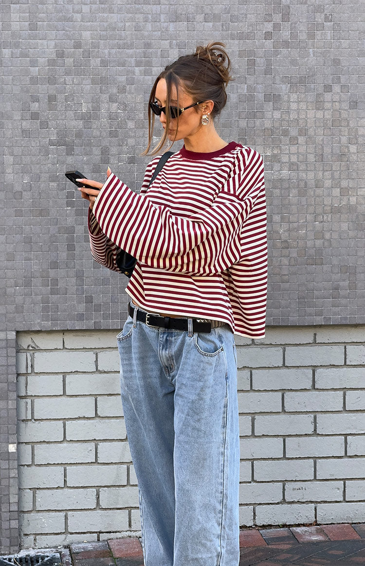 Beginning Boutique Lioness Bloom Wine Stripe Long Sleeve Top wine and cream striped crew neck long sleeve top with wide sleeves and cropped relaxed fit