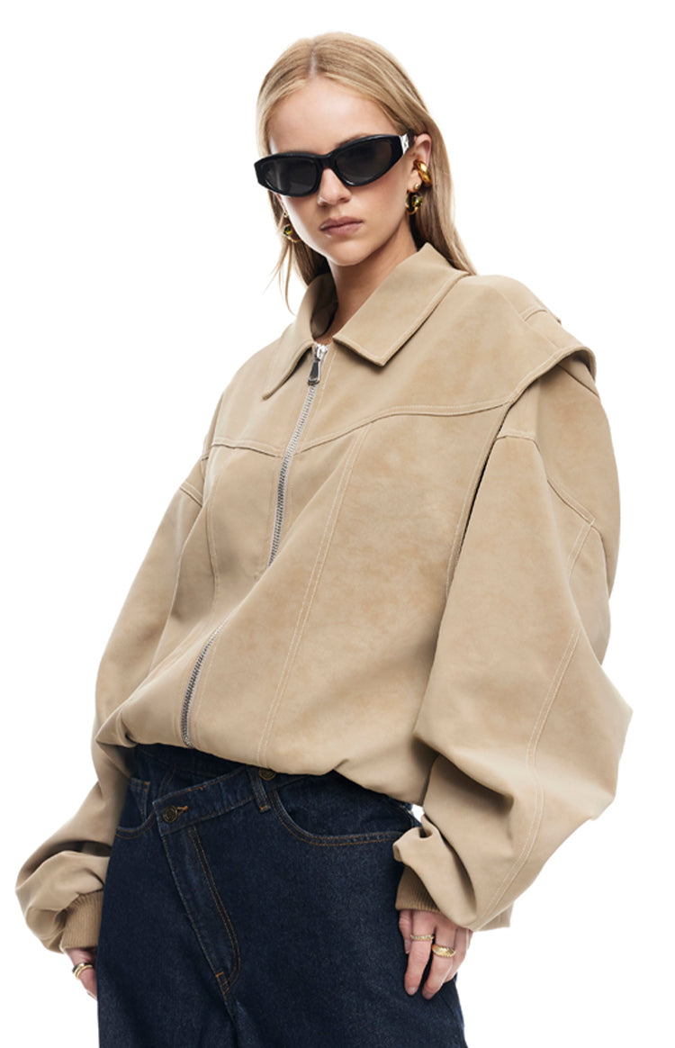 Front view of an oversized latte faux suede bomber jacket with a full zip and unique dropped shoulder detail
