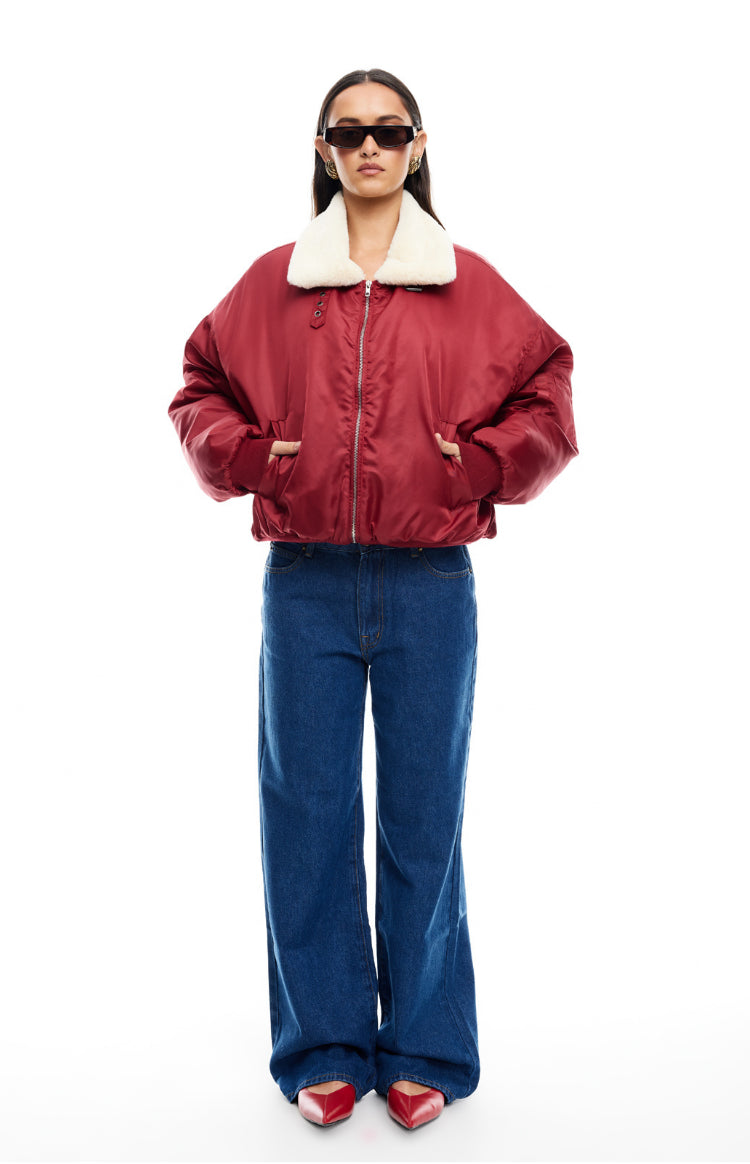 Front view of a mulberry oversized puffer jacket with a cream faux fur collar and silver zip front