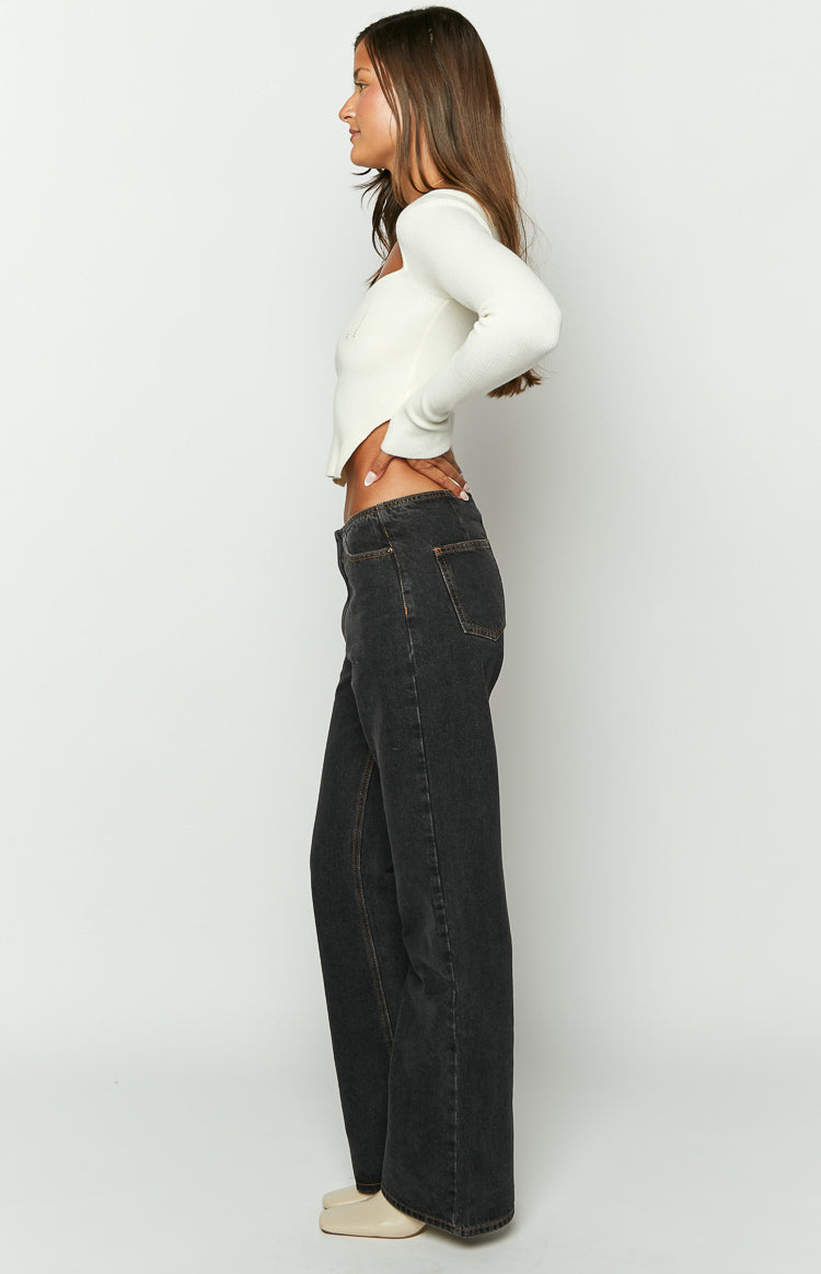 Side view of charcoal relaxed fit straight leg jeans with a mid-rise waist and contrast stitching