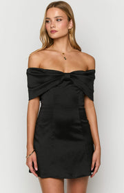 Close-up of the black textured satin off-shoulder mini dress with a large bow detail at the bust