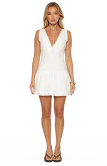 White cotton mini dress with a V-neck broderie bodice, scalloped armholes, and a gathered skirt