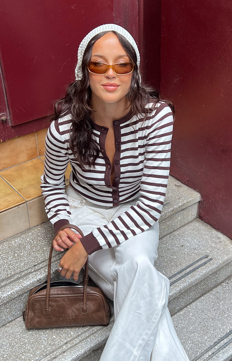 Chocolate and white stripe cardigan with a round neck, button-front, and ribbed chocolate cuffs