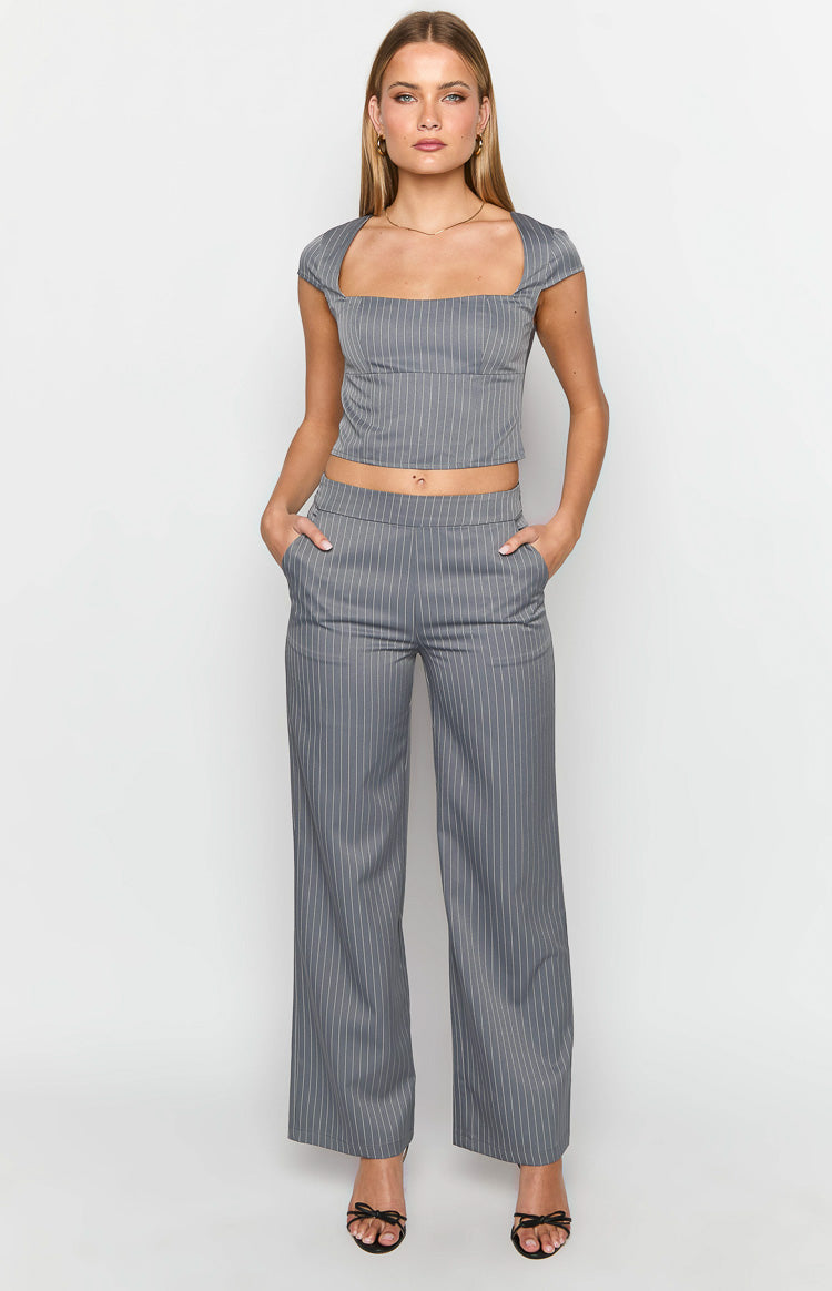 Grey pinstripe cropped top with a square neckline and short cap sleeves showing its fitted silhouette