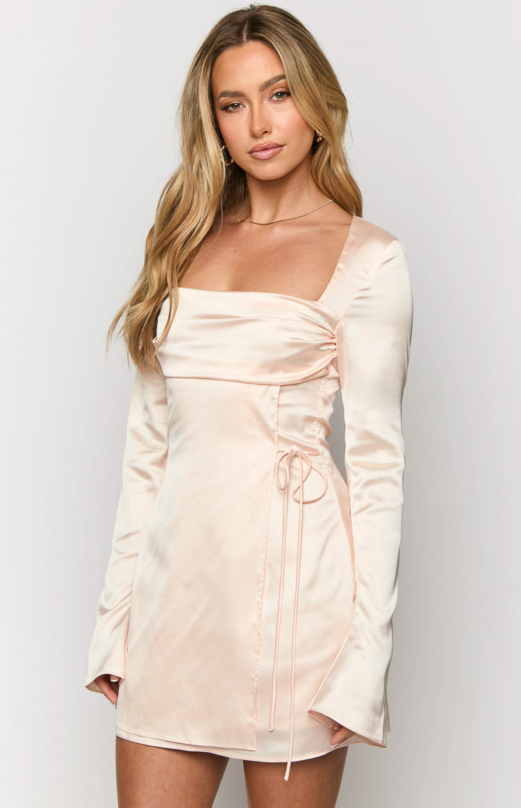 Close-up of the cream satin mini dress showing the square neckline, ruched bust, and side drawstring detail