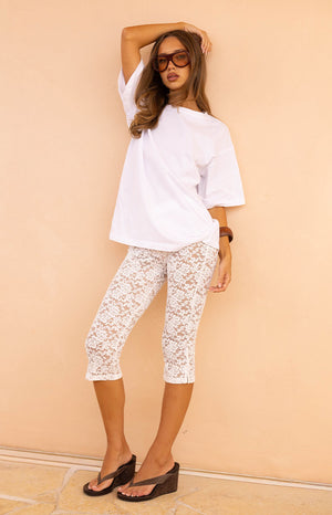 Beginning Boutique Lydia White Lace Mid Rise Capri Pants white floral lace fitted mid-rise capri pants
