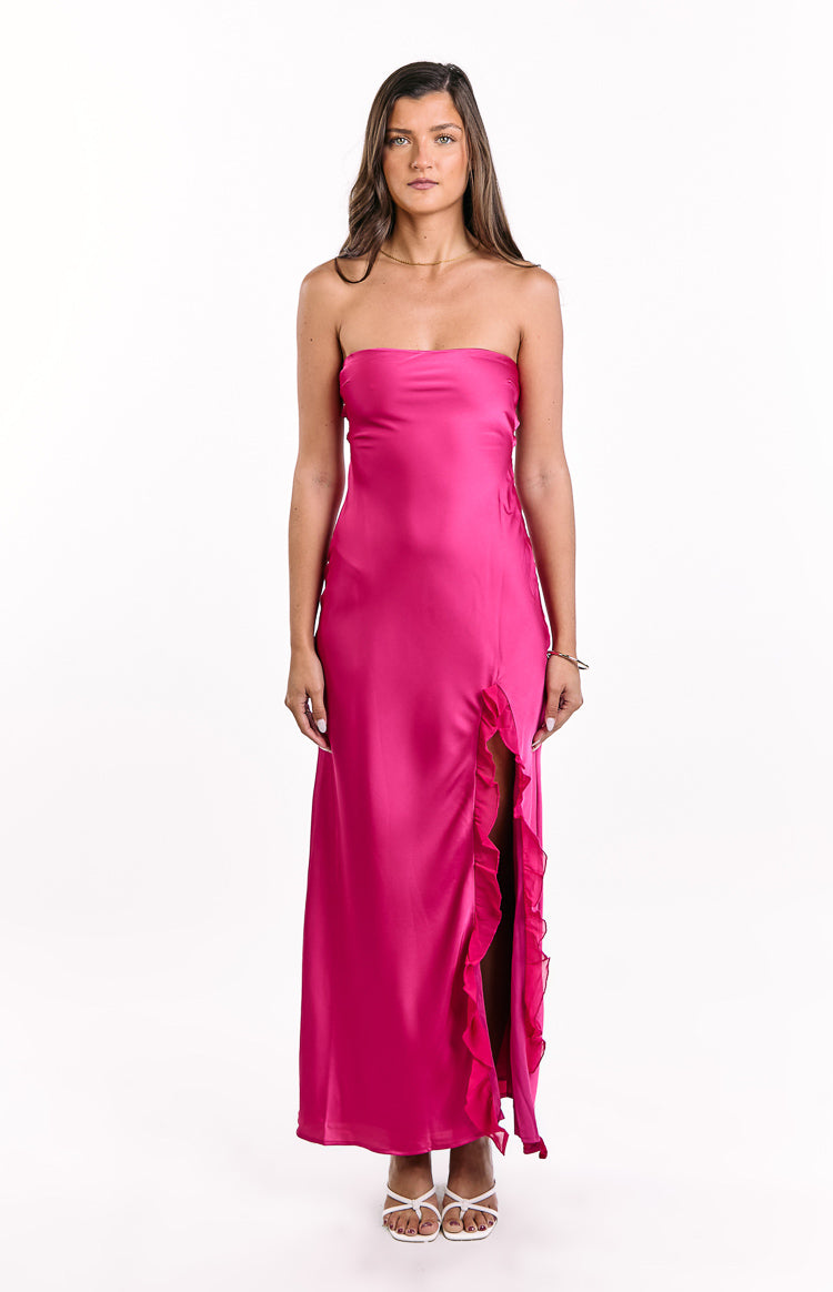 Hot pink strapless maxi dress with a high side slit adorned with cascading ruffles