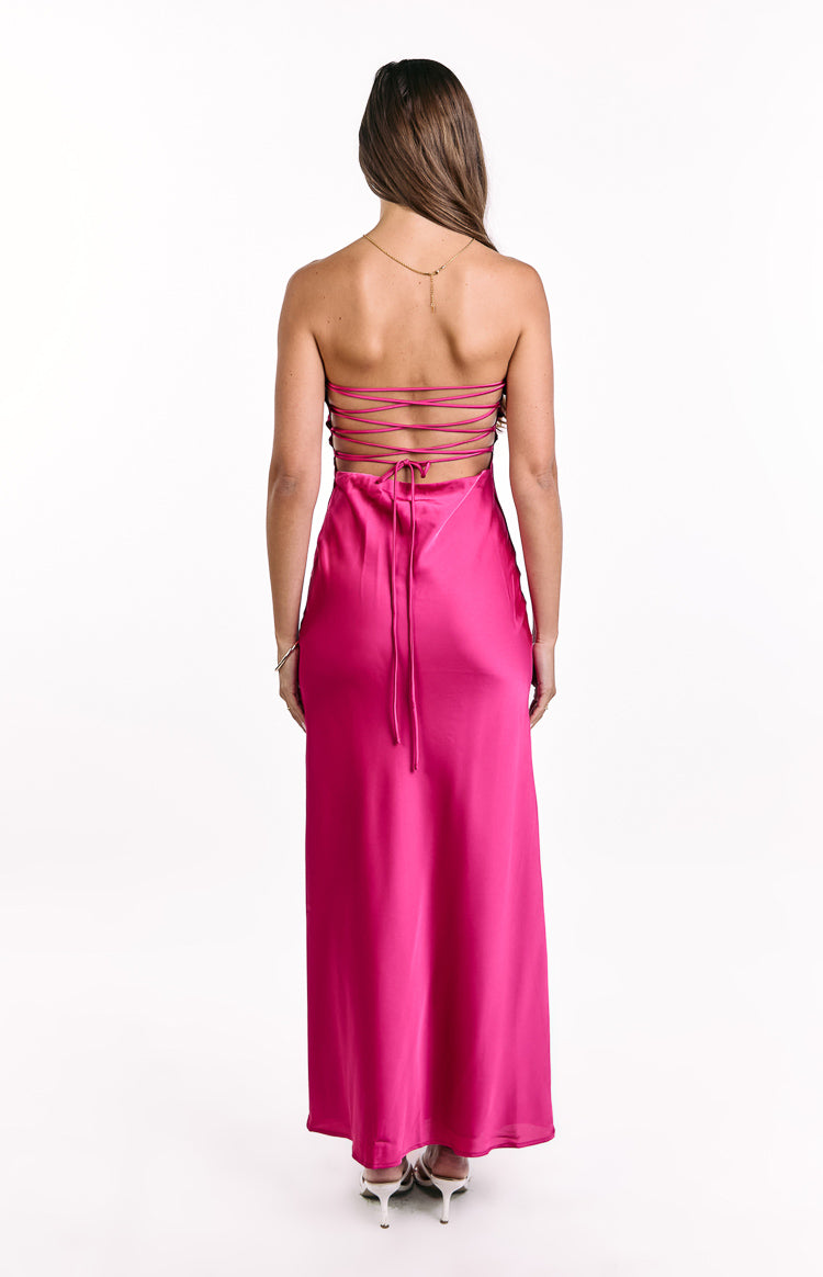 Rear view of a hot pink satin maxi dress with a criss-cross lace-up open back and long ties