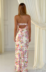 Rear view of a yellow floral strapless maxi dress with a ruched upper back band and cowl drape cutout