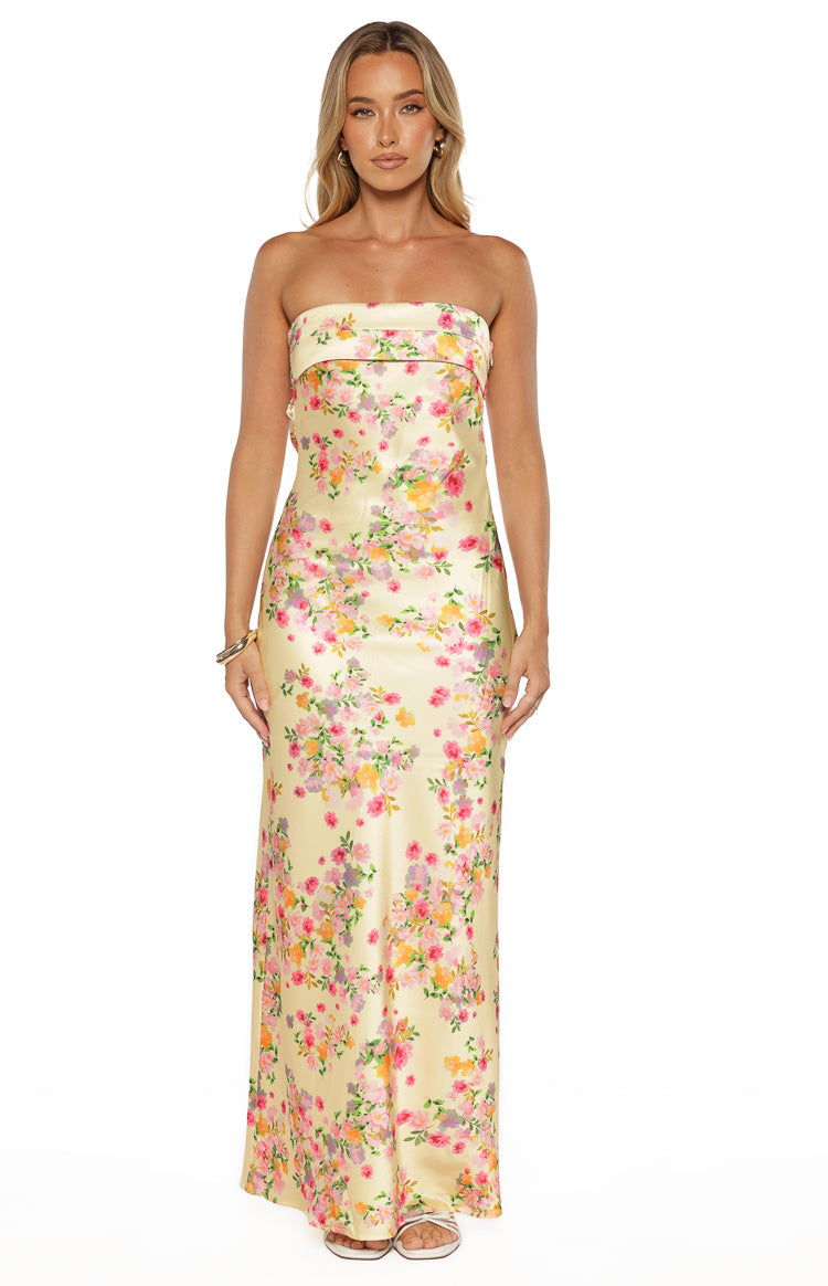 Yellow strapless maxi dress with a vibrant pink, orange, and purple floral print and relaxed fit