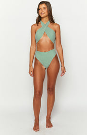 Front view of green and white vertical striped high-waisted bikini bottoms with a high-cut leg