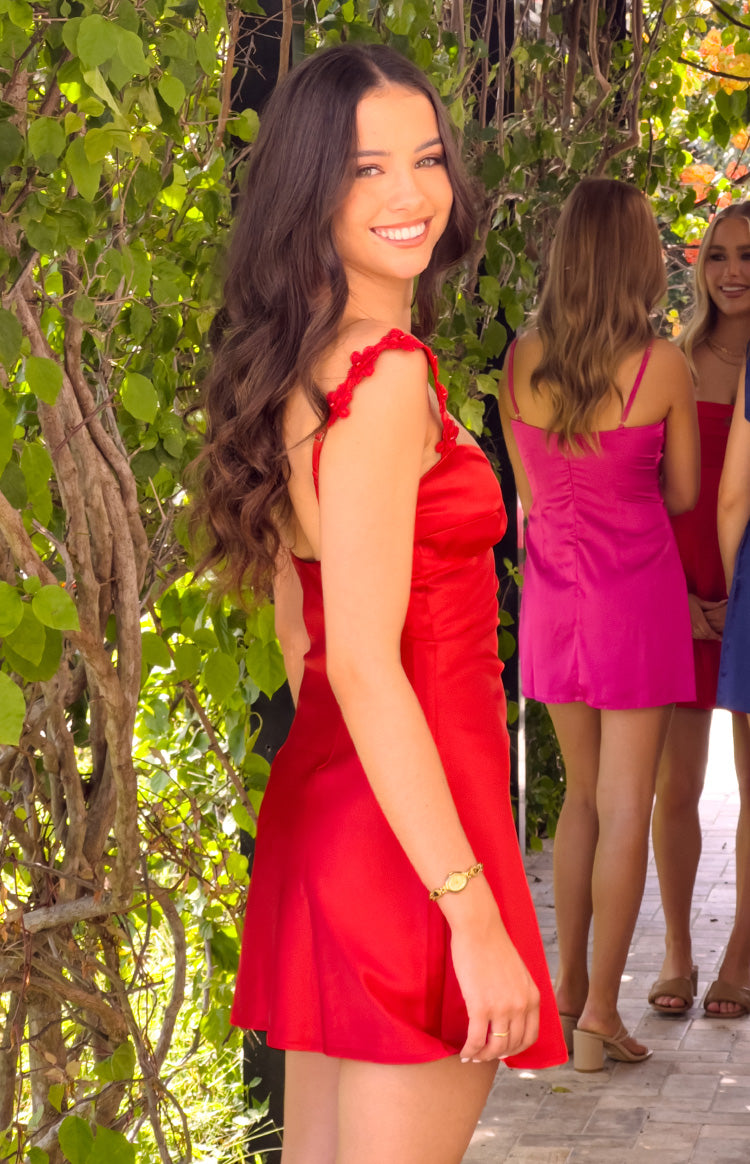 Side view of a red satin mini dress with delicate scalloped lace shoulder straps