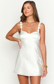 White satin mini dress with a sweetheart neckline and delicate floral embellished straps