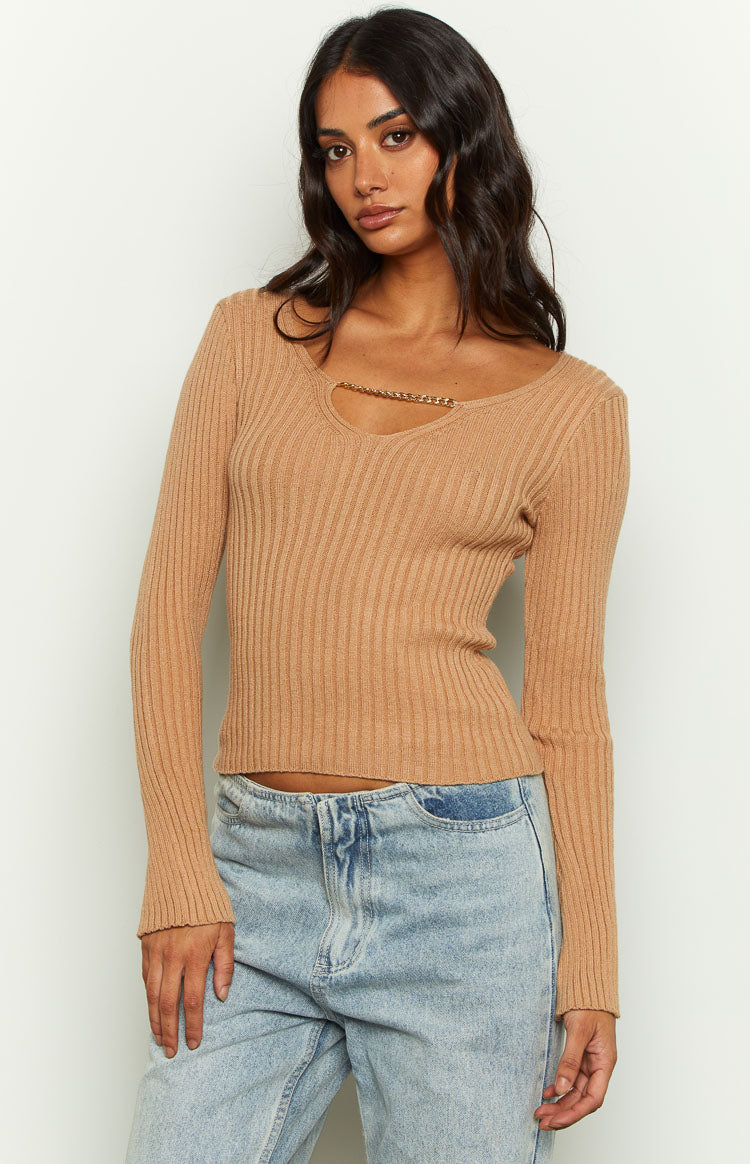 Front view of a beige ribbed knit jumper featuring a gold chain detail across the wide scoop neckline