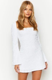 White velvet sequin mini dress with a square neckline and long flared sleeves