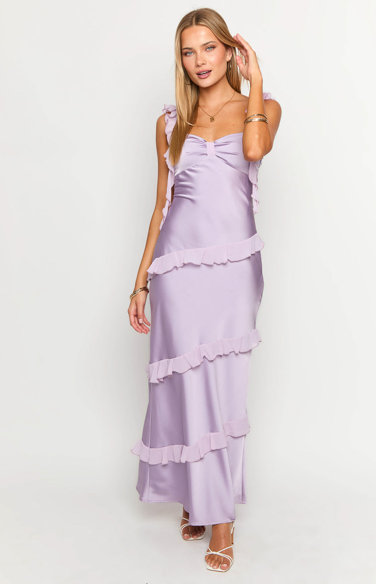 Purple satin maxi dress with a gathered sweetheart neckline, ruffled straps, and tiered ruffles on the skirt and bodice sides