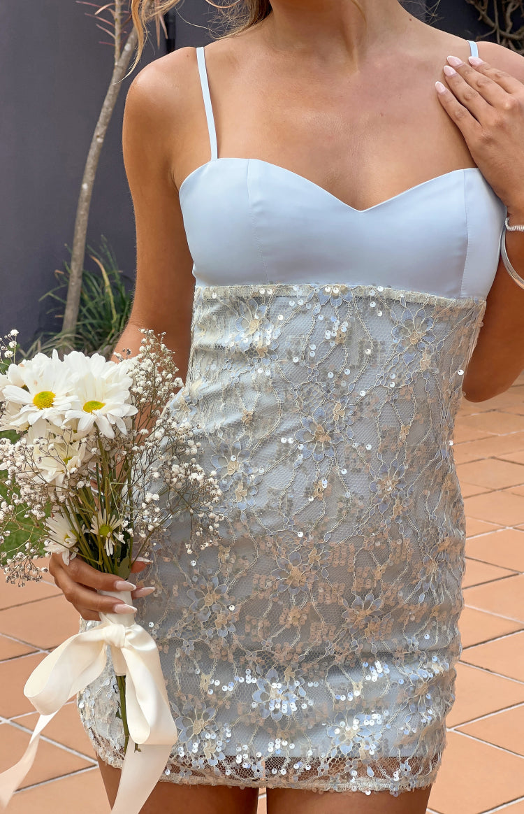 Close-up of the blue satin sweetheart neckline and sequin lace bodycon mini dress