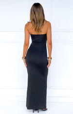 Rear view of a black strapless maxi dress with a fitted silhouette