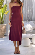Plum strapless midi dress with a fitted bodice and an asymmetrical hemline
