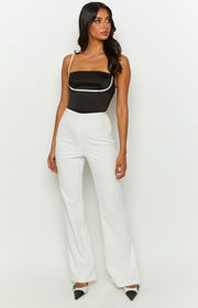White high-waisted tailored pants with a straight-leg cut and full length