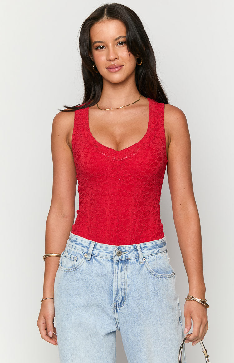 Front view of a red lace V-neck sleeveless bodysuit, highlighting the intricate floral lace pattern