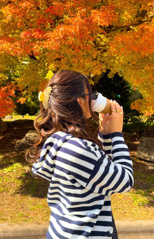 Beginning Boutique Mollie Navy Stripe Knit Zip Sweater navy and white striped knit hooded sweater with long sleeves and ribbed cuffs