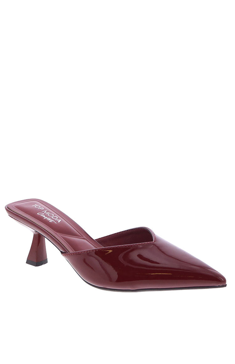 A pair of cherry red patent mule heels with an open toe and stiletto heel for a night out.
