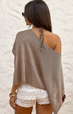 Rear view of white lace micro shorts with multiple tiered ruffles