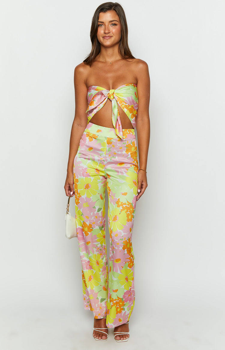 Front view of yellow floral wide-leg pants with pink, orange, and light green flower print