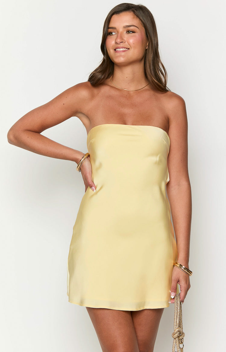 Front view of a yellow satin strapless mini dress with a straight neckline and relaxed fit