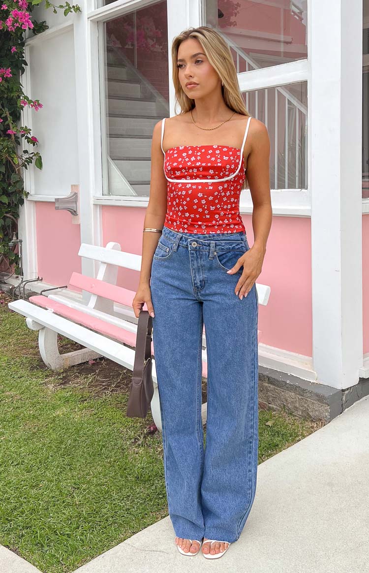 Full length view of blue wide-leg jeans with a relaxed fit and an uneven waistline