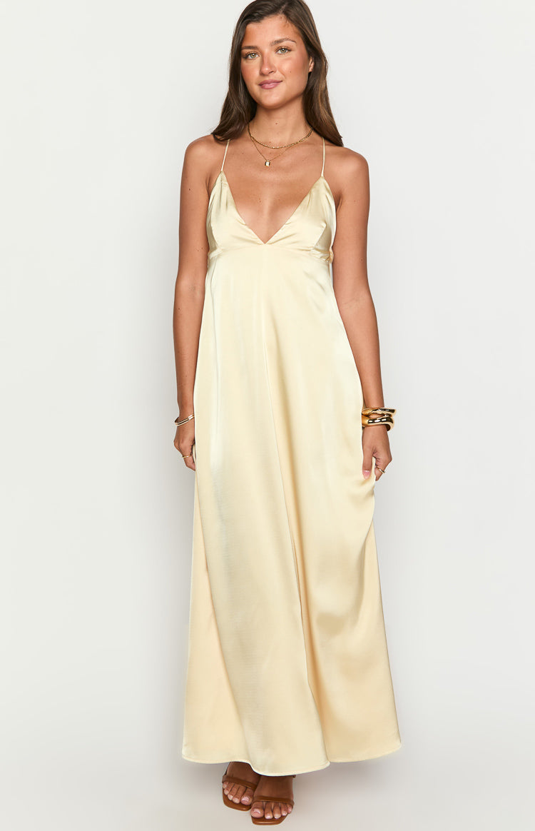 Front view of a yellow satin maxi dress with a deep V-neckline and delicate spaghetti straps