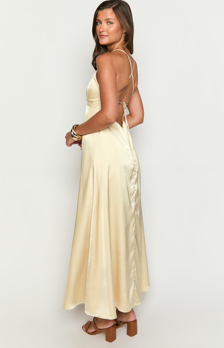 Beginning Boutique Nakita Yellow Maxi Dress pale yellow satin V-neck maxi dress with spaghetti straps and a low scoop back with tie detail