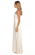 Side view of a cream satin maxi dress with thin spaghetti straps and a straight silhouette