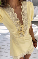 Beginning Boutique Nico Yellow Broderie Trim Mini Dress light yellow mini dress with scalloped broderie V-neck lace-up detail