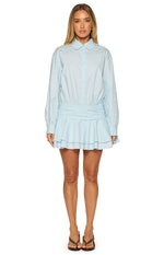 Front view of the light blue long sleeve mini shirt dress, showing the collared neckline, ruched waist, and tiered skirt