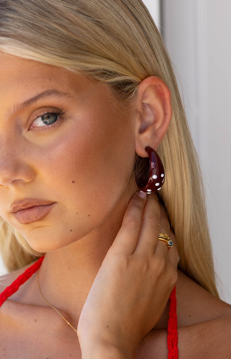 Beginning Boutique Norah Burgundy Polka Dot Chunky Hoop Earrings burgundy chunky hoop earrings with white polka dots
