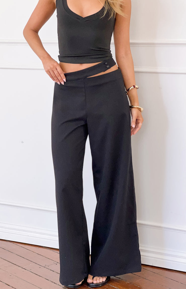 Beginning Boutique Oakley Black Asymmetric Waist Pants black wide-leg pants with an asymmetric button-closure waist