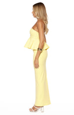 Side view of a yellow crepe maxi skirt with a fitted, straight-cut silhouette
