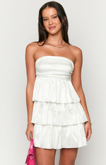 Front view of a white strapless mini dress with a ruched bodice and a tiered ruffled crinkle fabric skirt