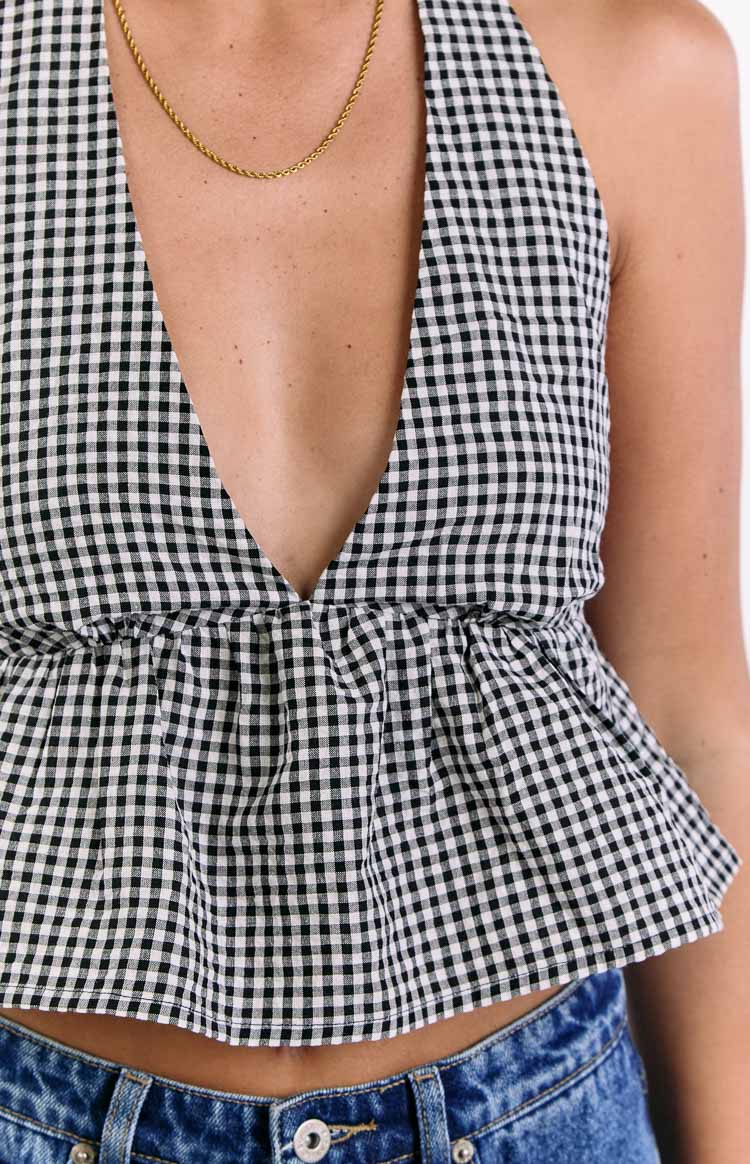 Close-up of the black gingham crop top showing the deep V-neckline and gathered elastic waist