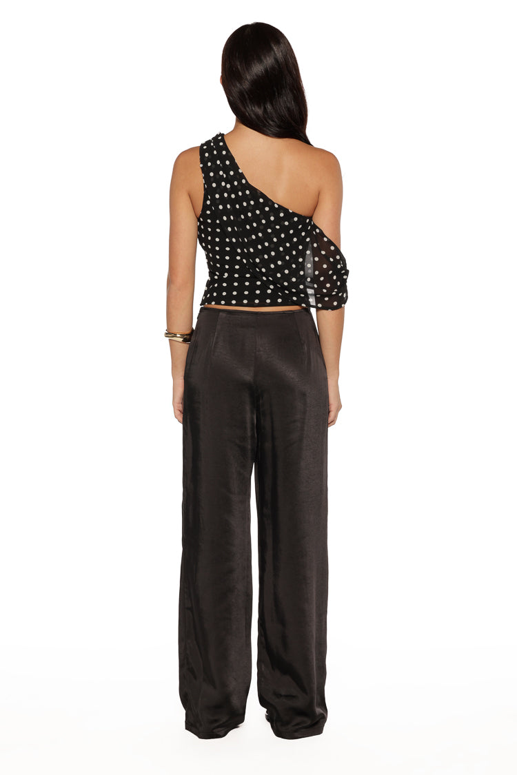 Rear view of black satin straight leg pants, highlighting the smooth back and fabric drape