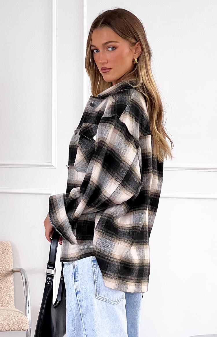 Oversized Orson Fleece Check Jacket in black, grey, and beige plaid, featuring a collared neckline and button-front chest pockets