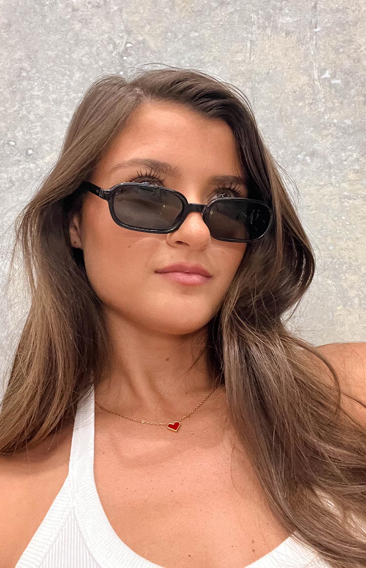 Beginning Boutique Otra Eyewear Frankie Black Rectangle Sunglasses black rectangle sunglasses with thick frames and dark lenses